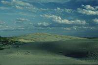Sand dune, sky and clouds