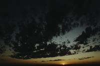 Dark dramatic clouds and sunset light