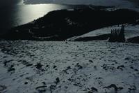 Sheep Mountain and sun glistening on lake
