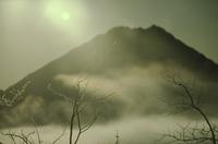 Mountains and mist - oriental green moon near Haines 