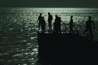 Silhouettes of Boys on Pier