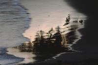 Dawn at Florencia Bay - reflections in wet sand