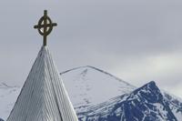 church with mountain peaks
