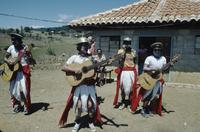 Mexican musicians in farm yard