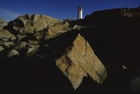 Lighthouse and rocks, morning light