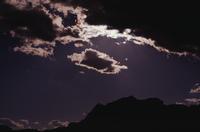 Sedona : cloud and stone silhouetted on purple sky 