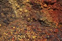 Multi-coloured lava rock slope