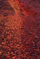 Multi-coloured lava rock slope