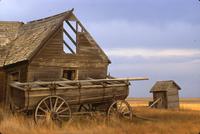 Abandoned farmhouse and water wagon, west of Lacadena