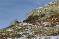 Colourful rock face with snow en route to Sturgis
