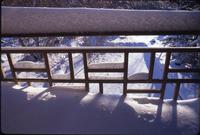 Reflecting pool - sequence of snow on upper patio fence patterns, looking down on pool