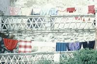 Clothes hanging from several balconies
