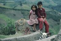 Two children and their dog in rural Ecuador
