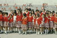 School girls in red sweaters