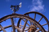 Abandoned farm, windmill and wagon wheels