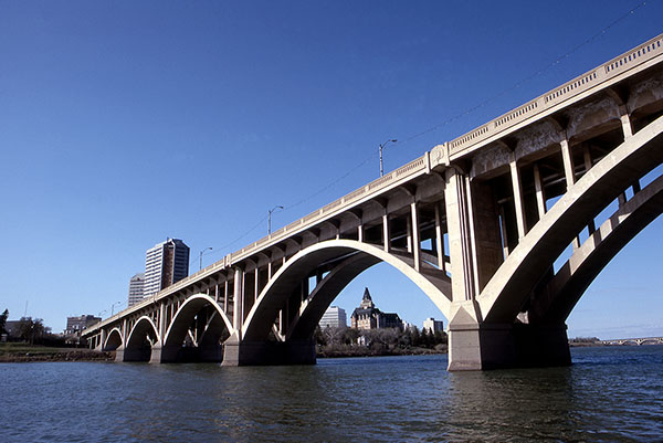 Bessborough seen across the Saskatchewan River through the arches of the Broadway Bridge