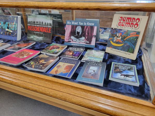 Display cabinet containing books published by Coteau Books